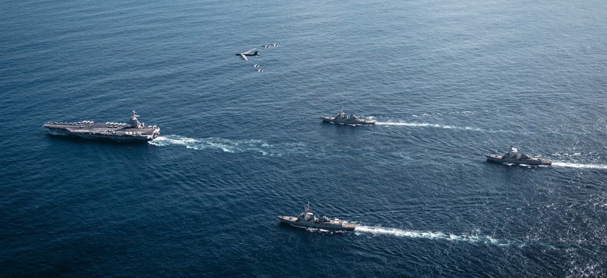 The U.S. Navy's aircraft carrier Gerald R. Ford, left; destroyers Winston S. Churchill, Mahan, Bainbridge; and F/A-18E/F Super Hornets—along with a U.S. Air Force B-52 Stratofortress—operate in U.S. Southern Command's area of operations on Nov. 13, 2025.