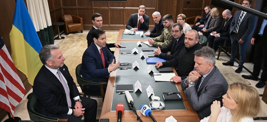 Secretary of State Marco Rubio (center L), flanked by White House Special Envoy Steve Witkoff and Jared Kushner, speaks during a meeting with Ukrainian officials in Hallandale Beach, Florida on November 30, 2025.