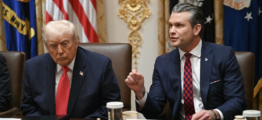 Defense Secretary Pete Hegseth speaks alongside President Donald Trump during a cabinet meeting at the White House on Dec. 2, 2025.