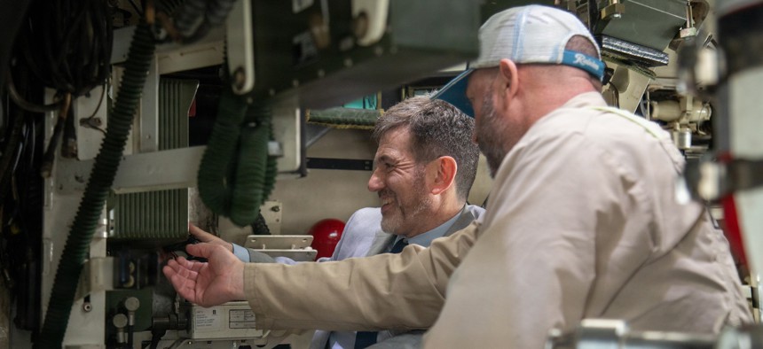 A General Dynamics representative explains the remote weapons system to Argentina's undersecretary of defense for international relations during a Stryker demonstration at Joint Base Lewis-McChord, Wash., Sept. 23, 2025.