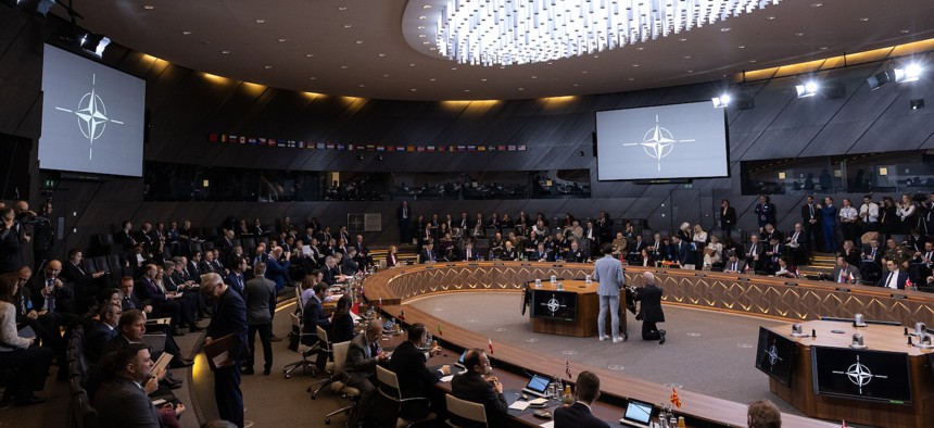 Delegates attend a meeting at NATO headquarters during the NATO Foreign Affairs Ministers' meeting, December 3, 2025 in Brussels, Belgium.