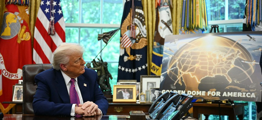 President Donald Trump listens during an announcement about the Golden Dome missile defense shield, in the White House, on May 20, 2025.