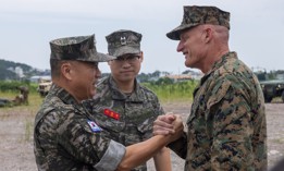 Republic of Korea Marine Corps Lt. Gen. Ju Il-Seok, left, commandant of the ROK Marine Corps, and U.S. Marine Corps Lt. Gen. Roger Turner, right, commanding general of III Marine Expeditionary Force, greet one another in Pohang, South Korea, Aug. 7, 2025.