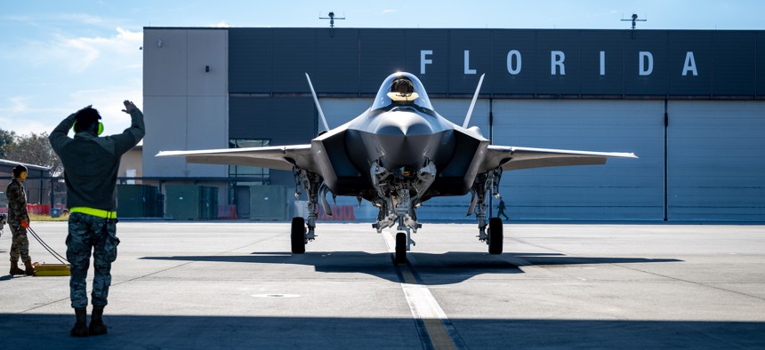 A crew chief at the Florida Air National Guard’s 125th Aircraft Maintenance Squadron marshals an F-35A Lightning II aircraft during a sortie generation exercise at Jacksonville Air National Guard Base, Florida, Dec. 3, 2025.