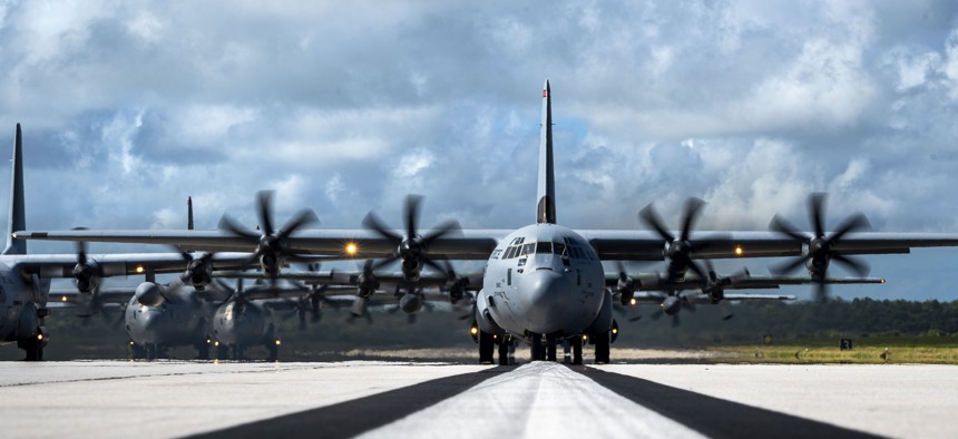 A formation of C-130J Super Hercules and C-130H Hercules aircraft from the U.S., Japan and Republic of Korea air forces taxi after an elephant walk during Operation Christmas Drop 2025 at Andersen Air Force Base, Guam, Dec. 13, 2025.