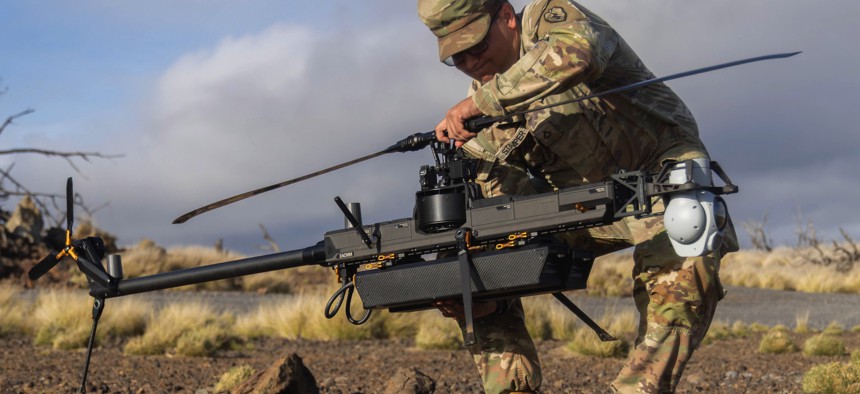 A soldier with the 25th Infantry Division assembles a Ghost-X reconnaissance drone during the Joint Pacific Multinational Readiness Center Rotation 26-01 on Pohakuloa Training Area, Hawaii, Oct. 29, 2025.