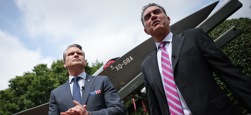 Defense Secretary Pete Hegseth is briefed on the XQ-58A Valkyrie by Emil Michael (R), under secretary of defense for research & engineering at the Pentagon, July 16, 2025.