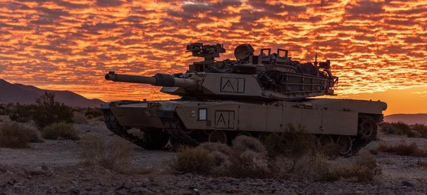 Soldiers with the 1st Infantry Division hold a defensive position in a M1 Abrams main battle tank during Rotation 24-11 at the National Training Center, Fort Irwin, Calif., Sept. 19, 2024.