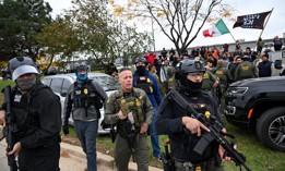Residents and protesters demonstrate against Border Patrol actions on October 22, 2025, in Cicero, Illinois. 
