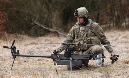 A soldier with the U.S. Army's 10th Mountain Division readies an Anduril Ghost-X helicopter surveillance drone during the Combined Resolve 25-1 military exercises at the Hohenfels Training Area near Hohenfels, Germany, on February 3, 2025.