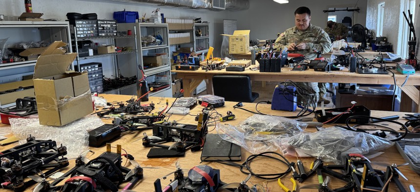 A soldier with the 25 th Infantry Division's Lighting Lab builds a drone, at Schofield Barracks, Hawaii, Nov. 13, 2025.