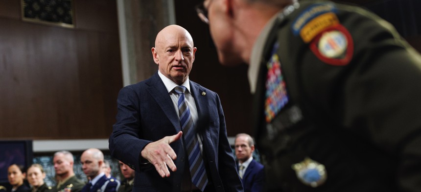 Sen. Mark Kelly, D-AZ, greets U.S. Army Lt. General Joshua Rudd during a Senate Armed Services Committee Confirmation Hearing on Capitol Hill on January 15, 2026, in Washington, D.C. 