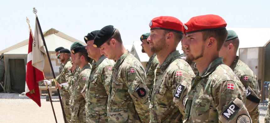 More than 18,000 Danish soldiers served in Afghanistan because U.S. officials asked for NATO's help. Here, Danish soldiers stand in formation during their end-of-mission ceremony at Camp Bastion in 2014.
