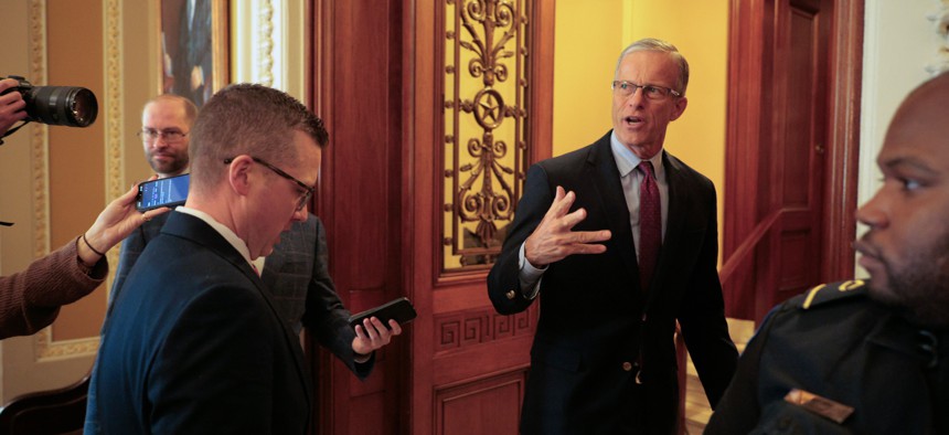 Senate Majority Leader John Thune, R-S.D., speaks briefly with reporters as he heads for the Senate Chamber at the U.S. Capitol on Jan. 30, 2026. Thune said he will bring compromise legislation between Senate Democrats and the White House up for a vote on Friday.
