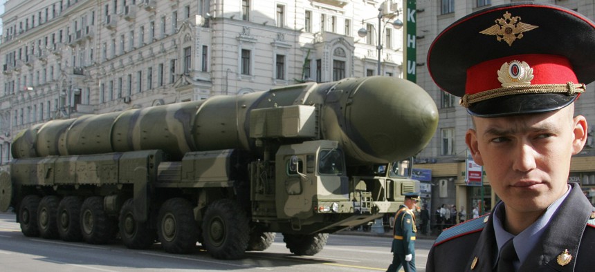 A Russian policeman guards in front of Topol-M ICBM during a rehearsal for the nation's Victory Day parade in Moscow in 2008. 