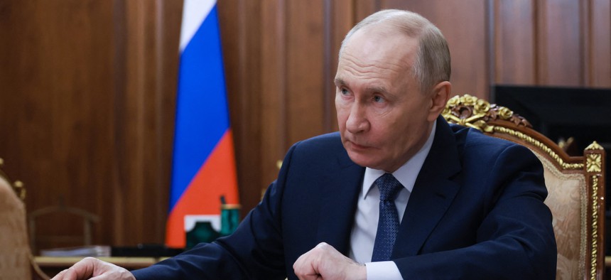 In this pool photograph distributed by the Russian state agency Sputnik, Russia's President Vladimir Putin attends a meeting with Moscow Mayor Sergei Sobyanin in Moscow on February 9, 2026.