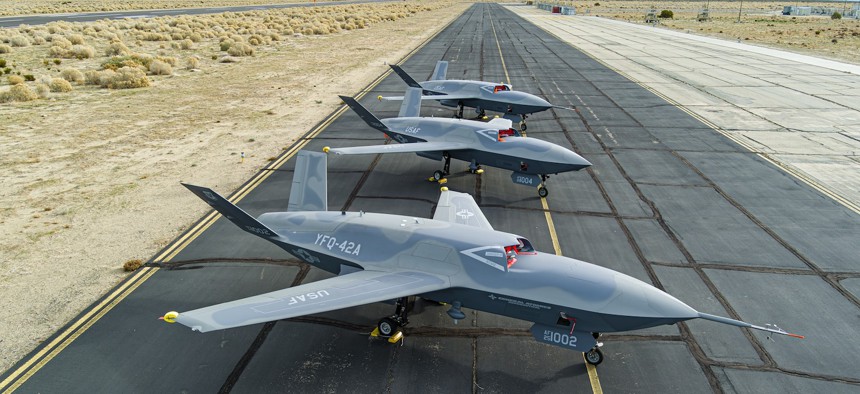 YFQ-42 aircraft sit on the flightline at a California test location as part of the Air Force’s Collaborative Combat Aircraft flight test campaign.