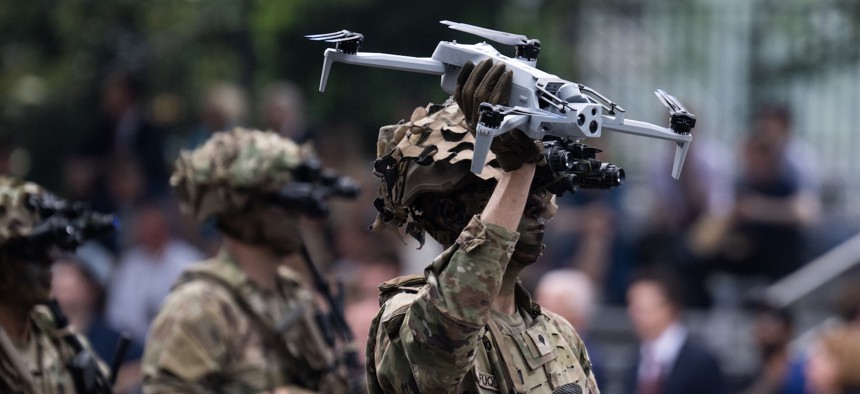 A soldier holds a drone in the U.S. Army's 250th anniversary parade in Washington, D.C., on Saturday, June 14, 2025. 