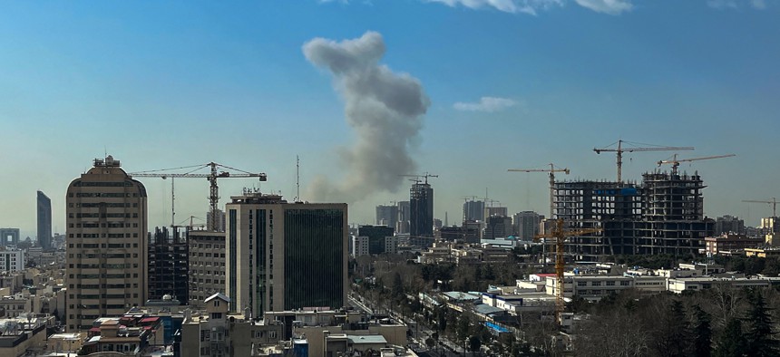 A plume of smoke rises following a reported explosion in Tehran on February 28, 2026.