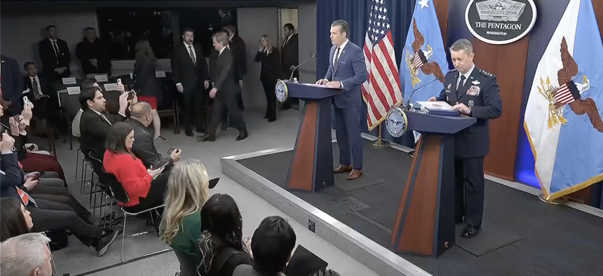 Defense Secretary Pete Hegseth and Joint Chiefs Chairman Gen. Dan Caine brief reporters on March 2, 2026.