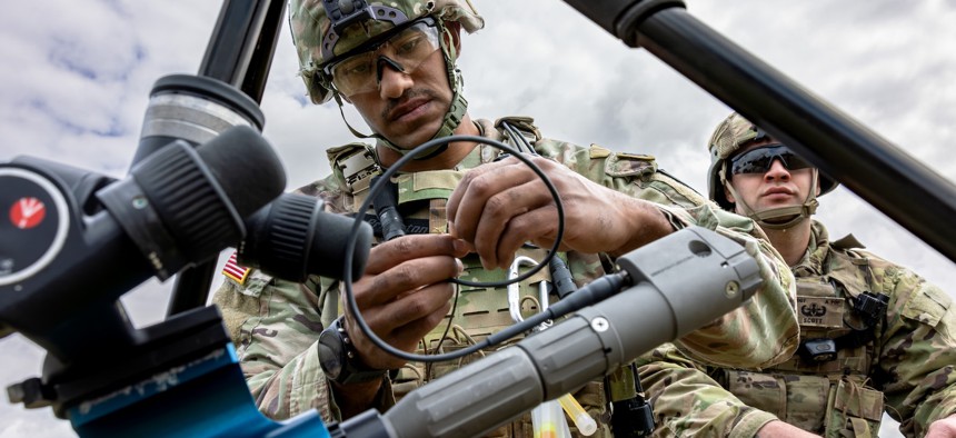 An explosive ordnance disposal soldier assembles a TiTAN disrupter system for unmanned aircraft system training at Balli Airfield, U.S. Army Garrison Bavaria, July 8, 2025. 