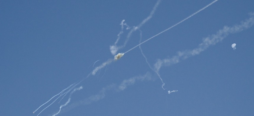 Explosions from the interception of an Iranian projectile are seen in the sky over Dubai on March 1, 2026. 