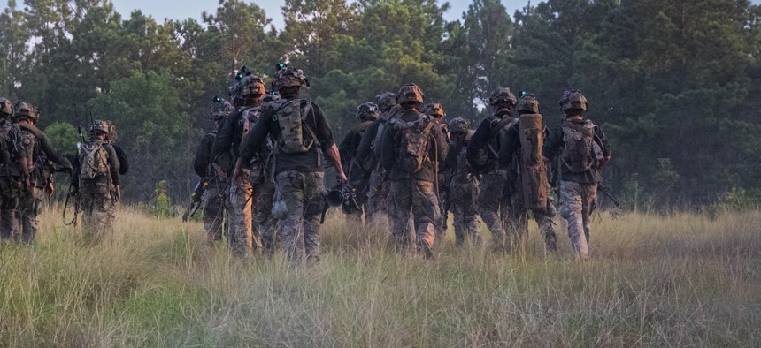 Paratroopers with the 82nd Airborne Division march to assault their objective during an exercise at Fort Bragg, North Carolina, on July 24, 2025. 