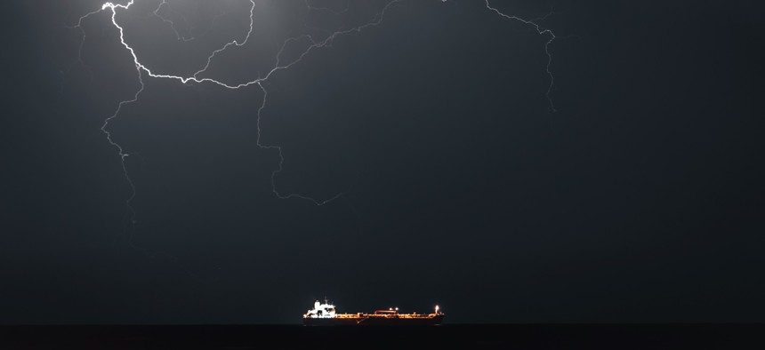 Lightning occurs when META 4, an Oil Products Tanker, sails into Muscat Anchorage on March 21, 2026 at Sultan Qaboos Port in Muscat, Oman.