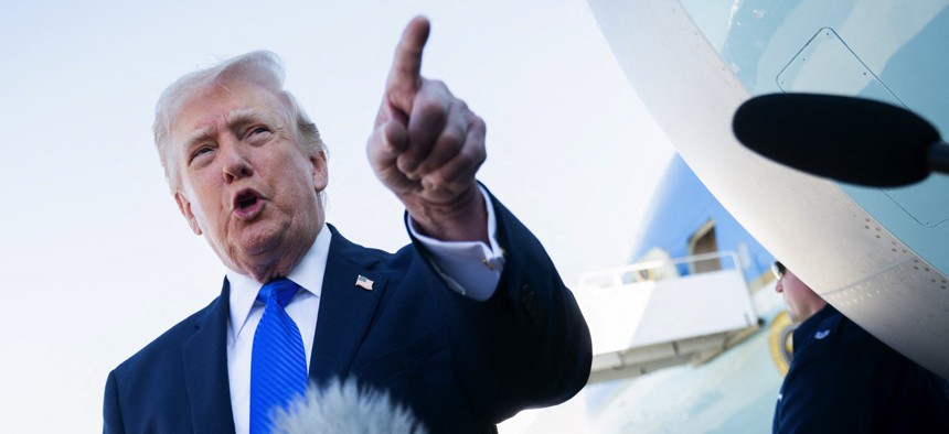 US President Donald Trump speaks to reporters before boarding Air Force One at Palm Beach International Airport in West Palm Beach, Florida, on March 23, 2026. 