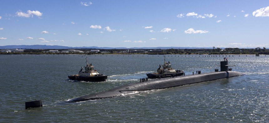 The Ohio-class guided-missile submarine USS Ohio prepares to moor alongside the forward-deployed submarine tender USS Frank Cable in Brisbane, Australia, for a scheduled port visit July 27, 2025. 
