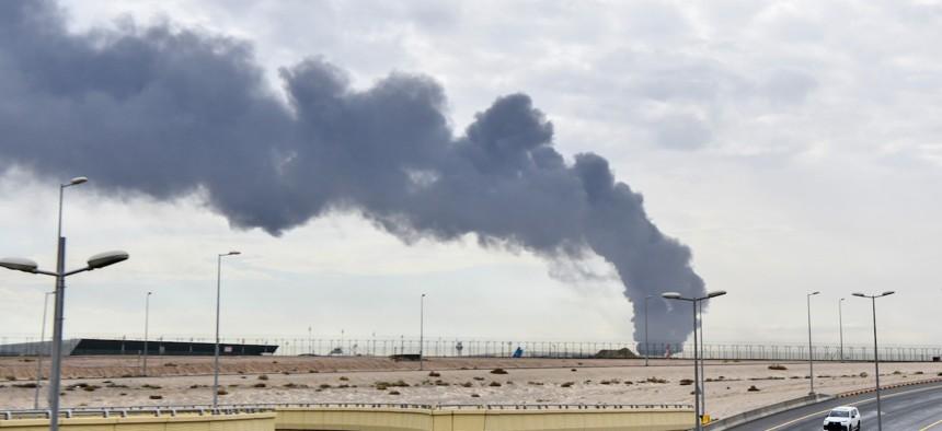 Smoke rises after Iranian drone carried out an attack on a fuel depot at Kuwait International Airport, March 25, 2026.