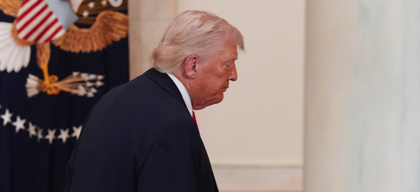 U.S. President Donald Trump departs after speaking about the Iran war from the Cross Hall of the White House on April 1, 2026, in Washington, D.C. 