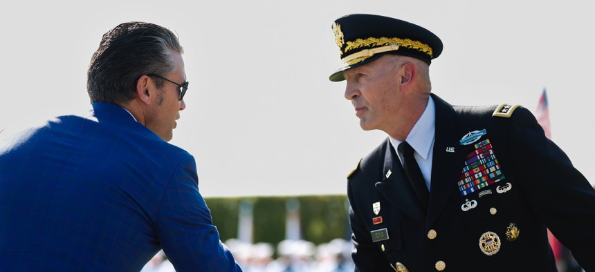 Defense Secretary Pete Hegseth shakes hands with U.S. Army Chief of Staff Gen. Randy George during a National Prisoner of POW/MIA Recognition Day ceremony at the Pentagon on September 19, 2025, in Arlington, Virginia.