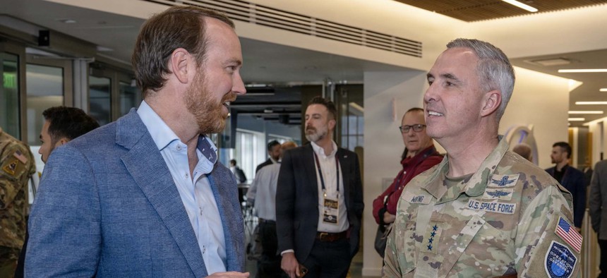 Robert Carlisle, CEO of Argo Space Corp., speaks with Gen. Stephen Whiting, commander of U.S. Space Command, at the Apollo Insight Commercial Integration tabletop exercise in Colorado Springs, Colo., March 23, 2026.