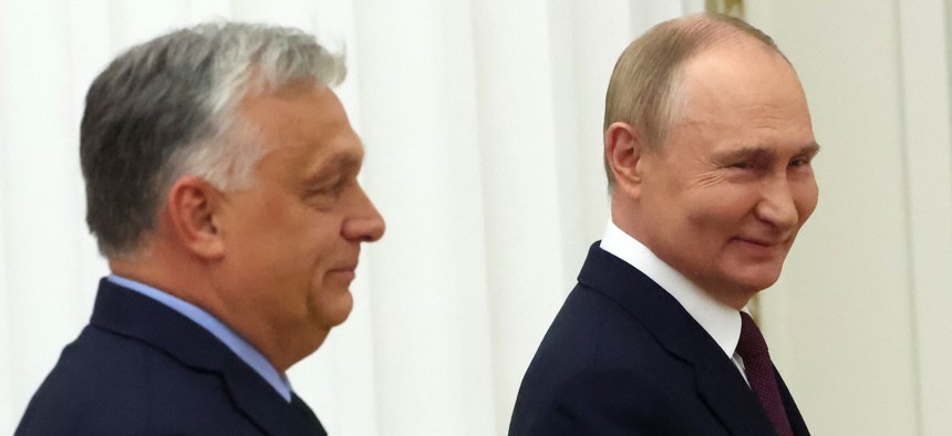Russian President Vladimir Putin (R) and Hungarian Prime Minister Viktor Orban (L) smile while leaving their joint press conference at the Kremlin on July 5, 2024, in Moscow, Russia. 