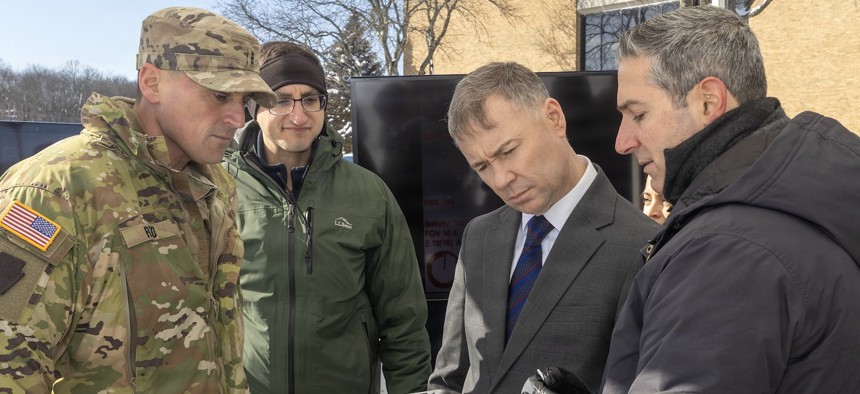 Chief Warrant Officer 3 Robert Reed, left, of the Pennsylvania National Guard Unmanned Aircraft Systems Training and Innovation Facility, takes part a UAS demonstration Jan. 20, 2026, at Picatinny Arsenal, New Jersey. 