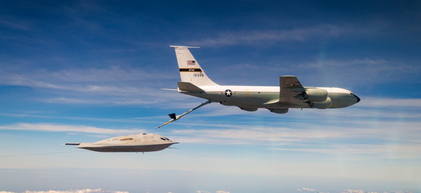 A B-21 Raider conducts aerial refueling with a KC-135 Stratotanker.