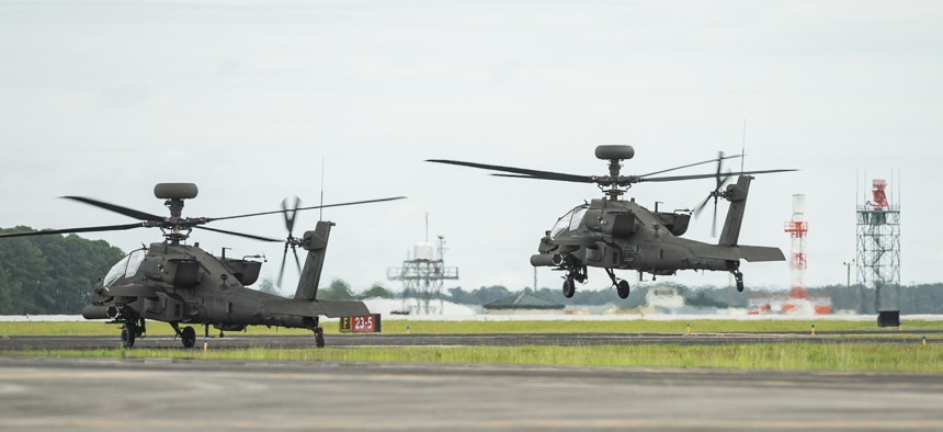 Apache helicopters with the South Carolina National Guard lift off during Operation Flyswatter, a counter-drone exercise at Marine Corps Air Station New River, North Carolina, on Aug. 12, 2025. 