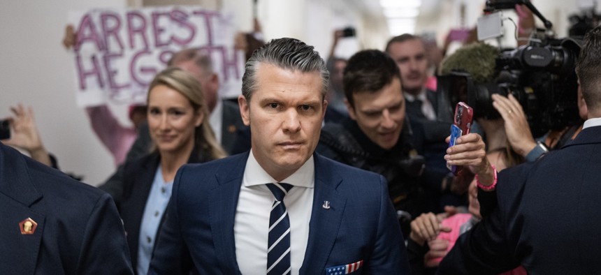 Defense Secretary Pete Hegseth and his wife, Jennifer, arrive for the House Armed Services Committee hearing on April 29, 2026. 