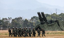 Taiwanese soldiers walk past a Sky Sword II Land-based Air Defence Missile launcher in Taichung, Taiwan, on January 27, 2026. 