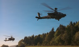 AH-64E Apache helicopters take off during an exercise at Joint Multinational Readiness Center’s Hohenfels Training Area, Germany, May 2, 2026. 