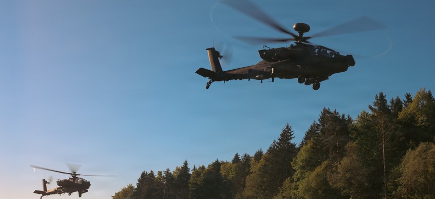 AH-64E Apache helicopters take off during an exercise at Joint Multinational Readiness Center’s Hohenfels Training Area, Germany, May 2, 2026. 