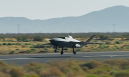 A YFQ-42A Collaborative Combat Aircraft takes off during flight testing at a California test location in 2025.