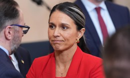 Director of National Intelligence Tulsi Gabbard stands after President Donald Trump spoke about the Iran war at the White House, April 1, 2026.