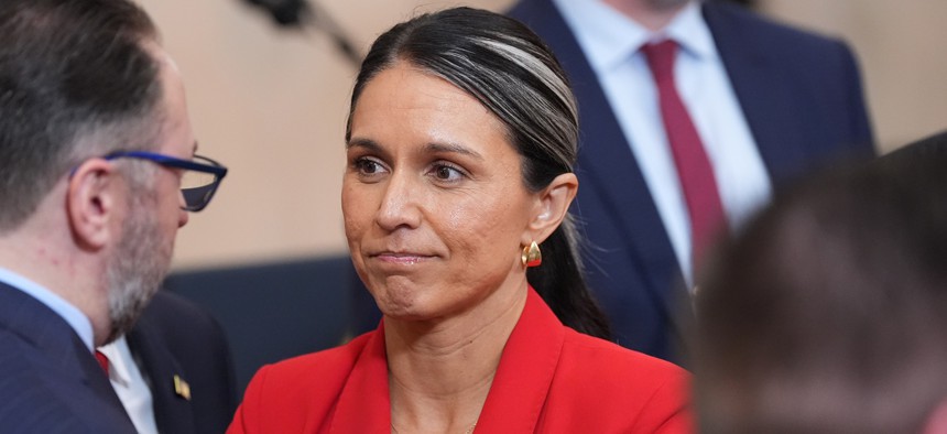 Director of National Intelligence Tulsi Gabbard stands after President Donald Trump spoke about the Iran war at the White House, April 1, 2026.