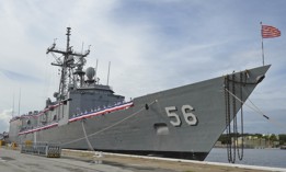 Sailors man the rails of the guided-missile frigate USS Simpson during its decommissioning ceremony in 2015.