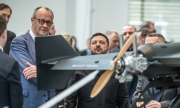 Ukrainian President Volodymyr Zelenskyy inspects a drone with German Federal Chancellor Friedrich Merz at an exhibition of German-Ukrainian products in the Federal Chancellery on April 14, 2026.