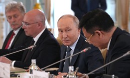 Russian President Vladimir Putin speaks to Xinhua News Agency chief Fu Hua on the sidelines of the St. Petersburg International Economic Forum in Saint Petersburg on June 4, 2026. 