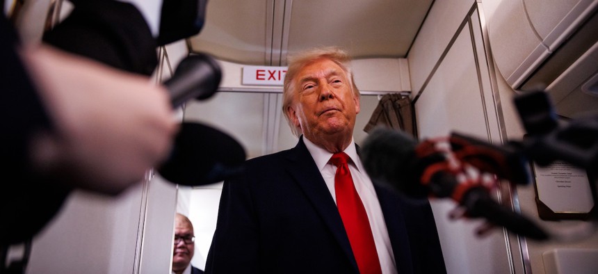 President Trump speaks with reporters while aboard Air Force One on June 5, 2026, en route to Chippewa Falls, Wis. Schedule Policy/Career is formerly known as Schedule F, and makes it easier to fire federal employees in “policy-related” jobs.