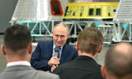 Russia's President Vladimir Putin talking with young scientists during a visit to the Rocket and Space Corporation (RSC) Energia in Korolyov, outside Moscow, on October 26, 2023.